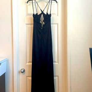 Super sexy long black dress with front rushing down the front. Size small NWT